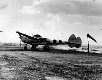 Click image for larger version

Name:	P-38J_with_D-Day_stripes_serial_42-68071_of_the_392nd_FS_367th_FG_sits_on_the_newly-constructed_.jpg
Views:	89
Size:	178.5 KB
ID:	2183418